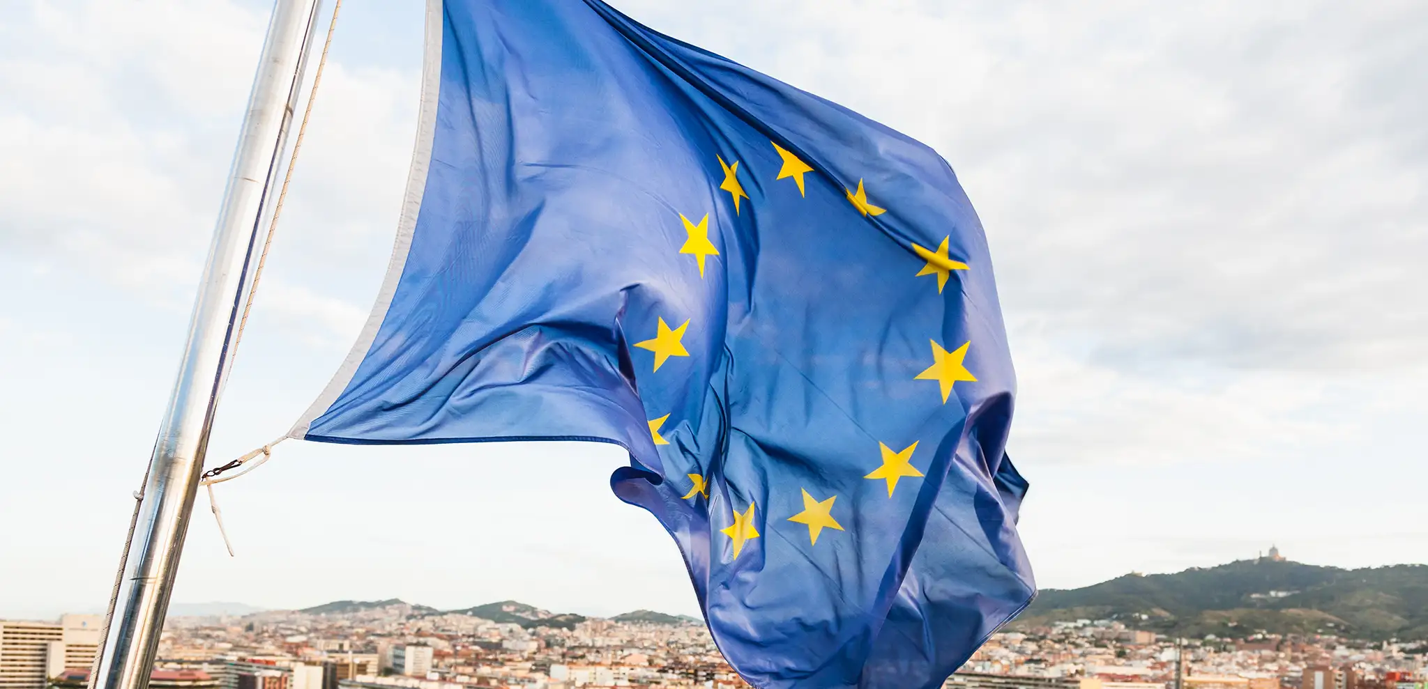 EU flag over cityscape