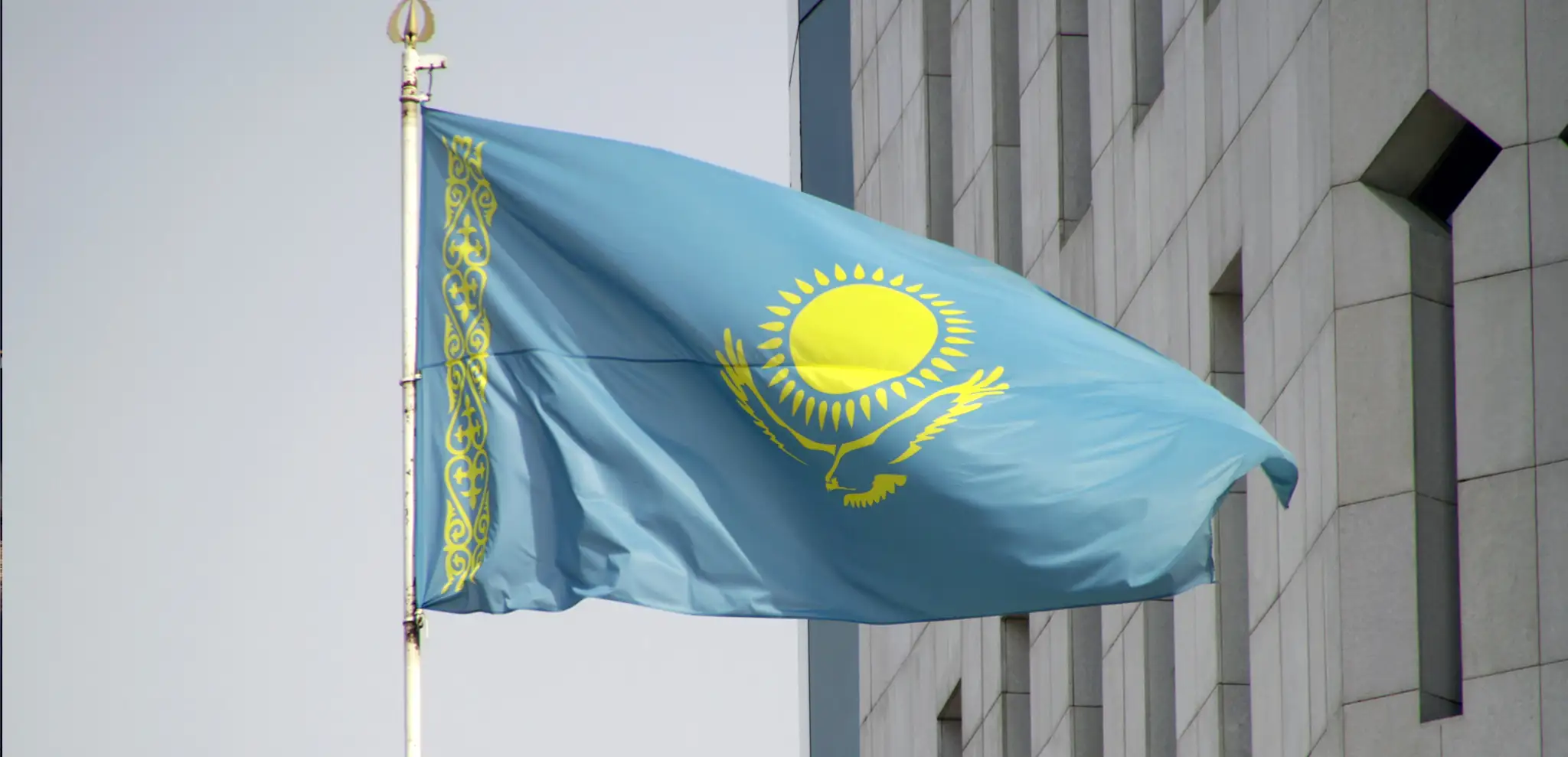 national flag of kazakhstan waving from wind
